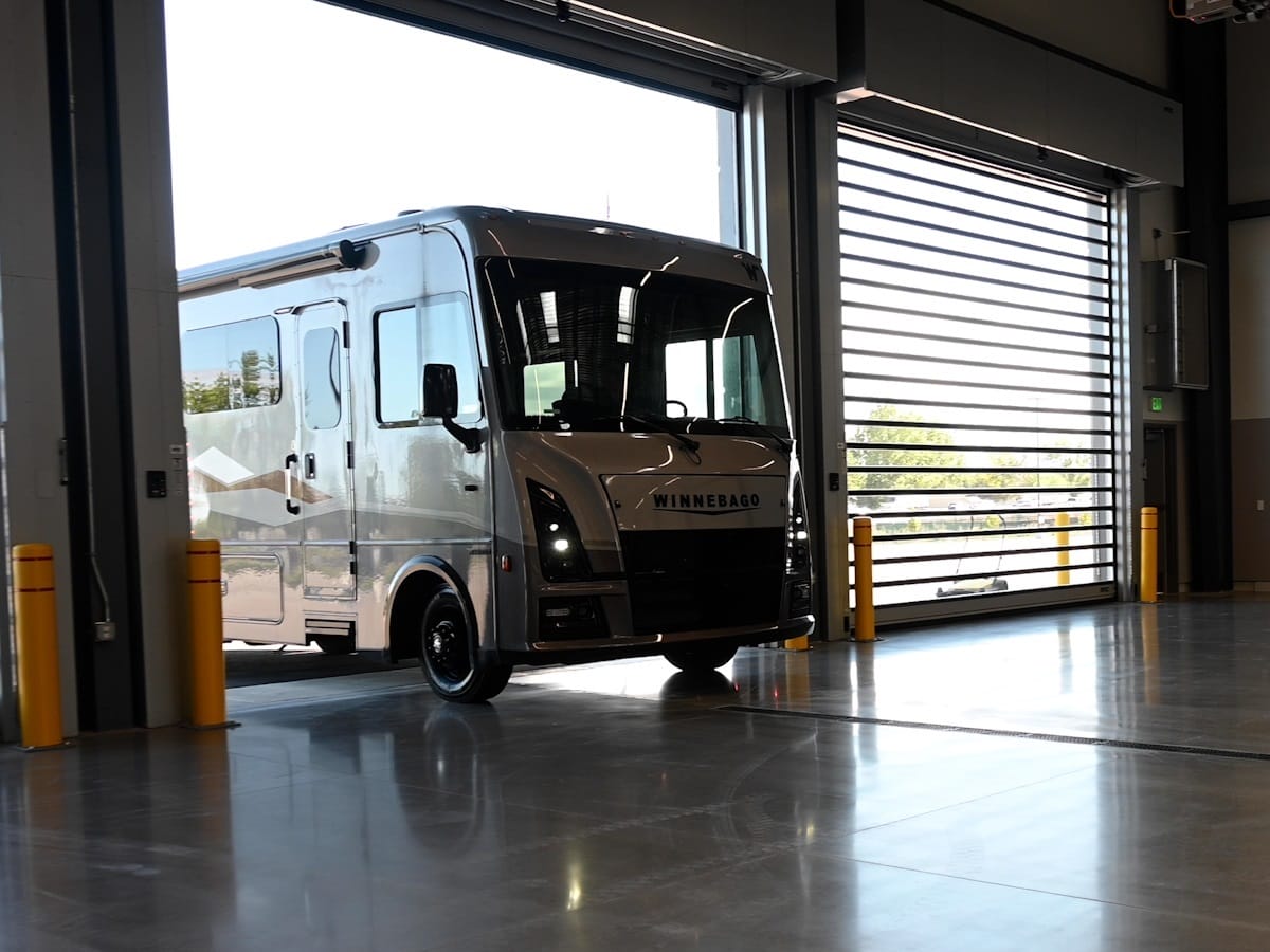 RV driving into Ford Commercial Service Center service bay for maintenance